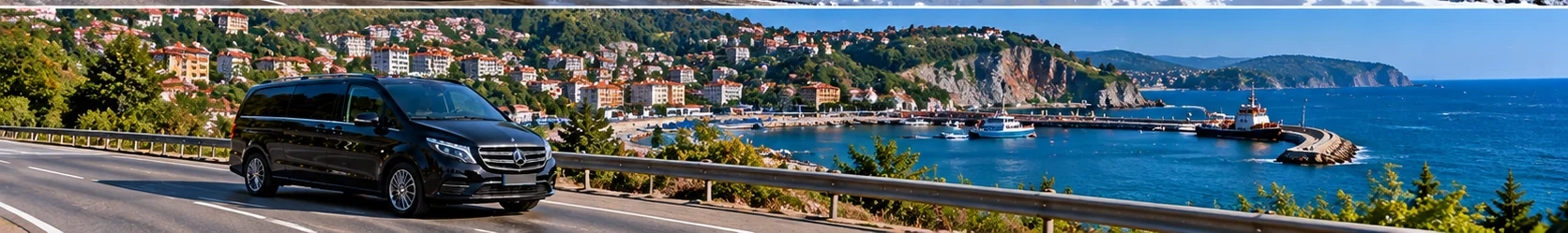 Original illustrative black private transfer minivan on the Black Sea coastal road towards Zonguldak
